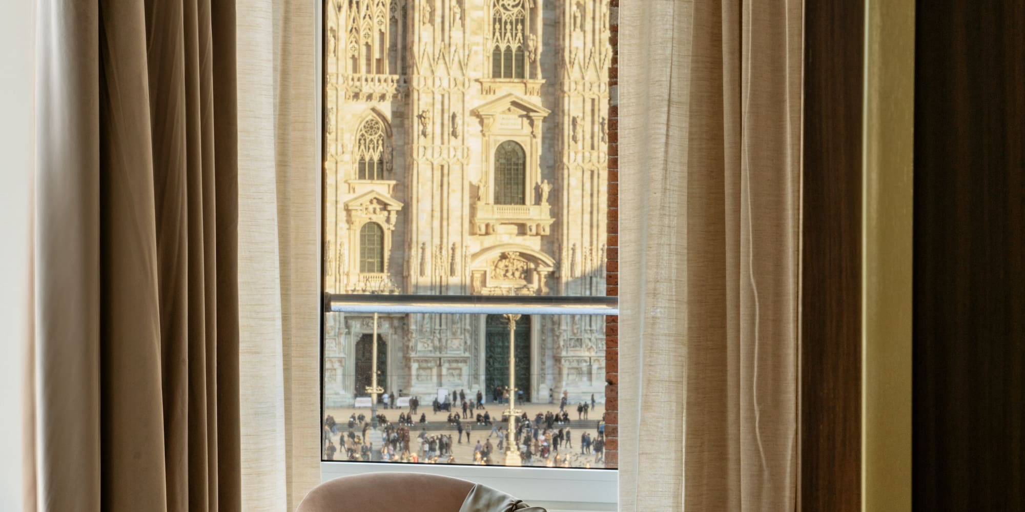 a chair in front of a window with a large building in the background