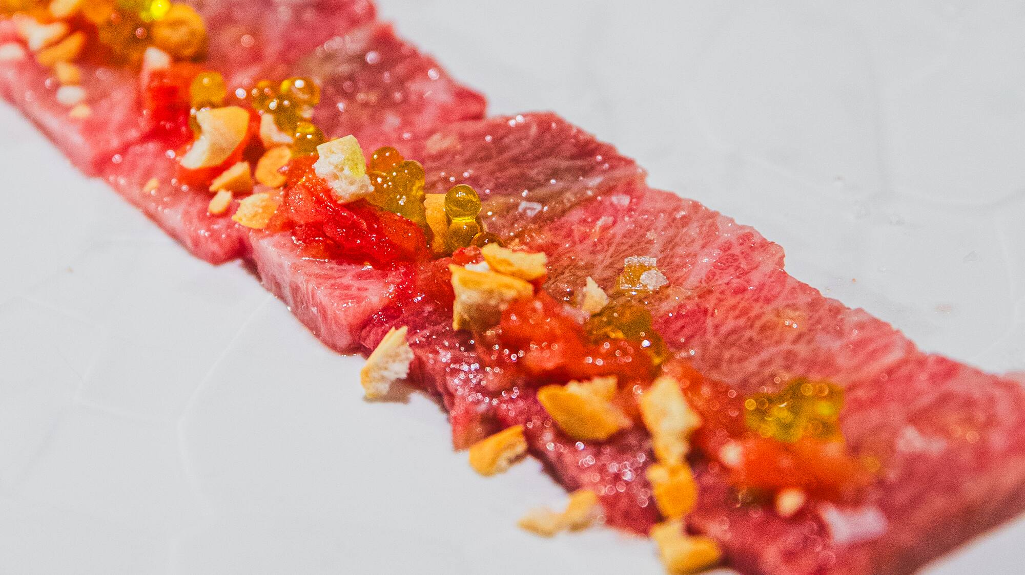 a plate of food on a white surface