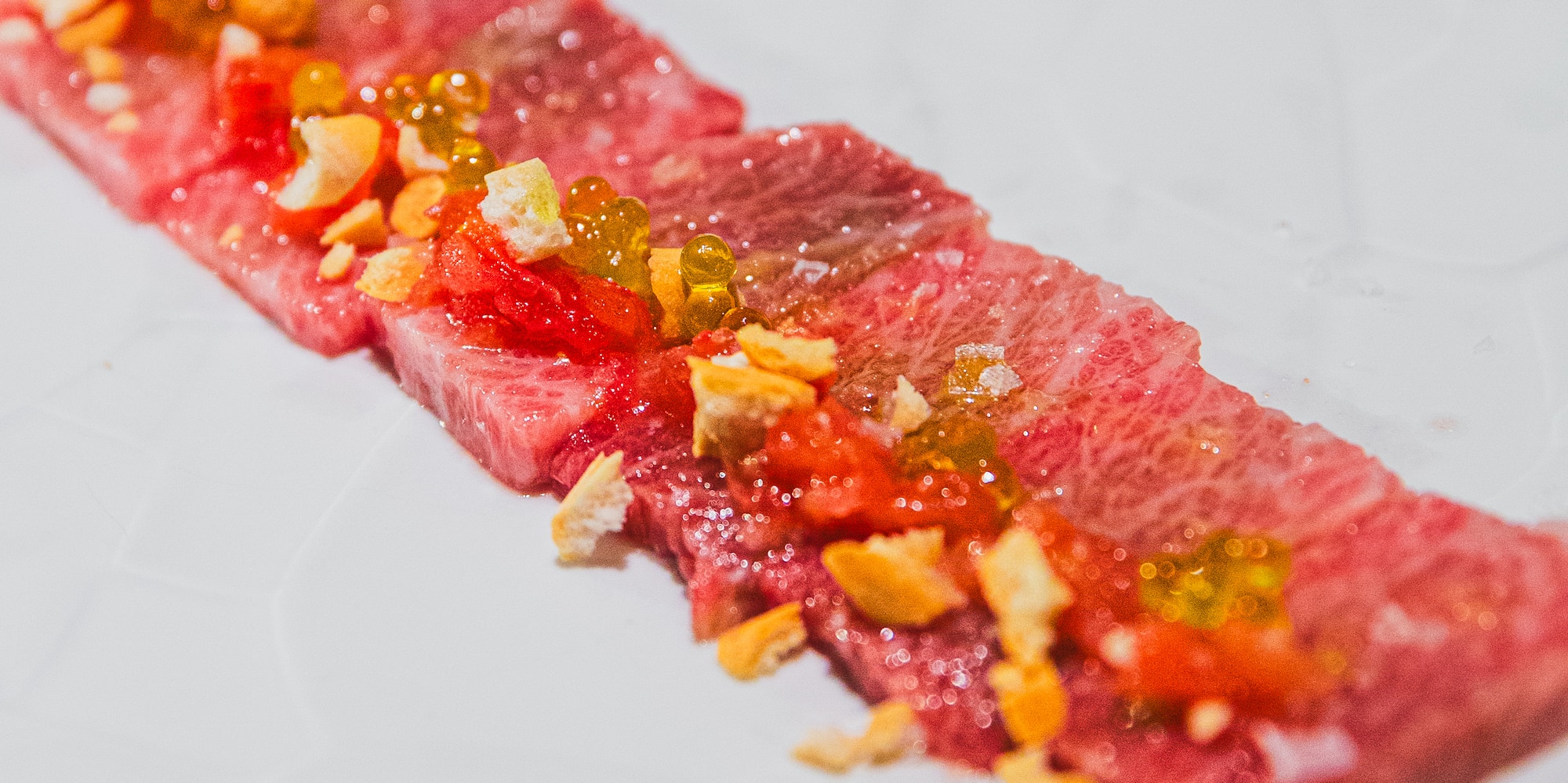 a plate of food on a white surface