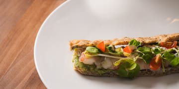 a plate of food and a glass of wine