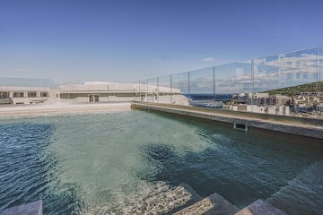a pool with a glass fence