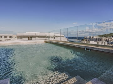 a pool with a glass fence