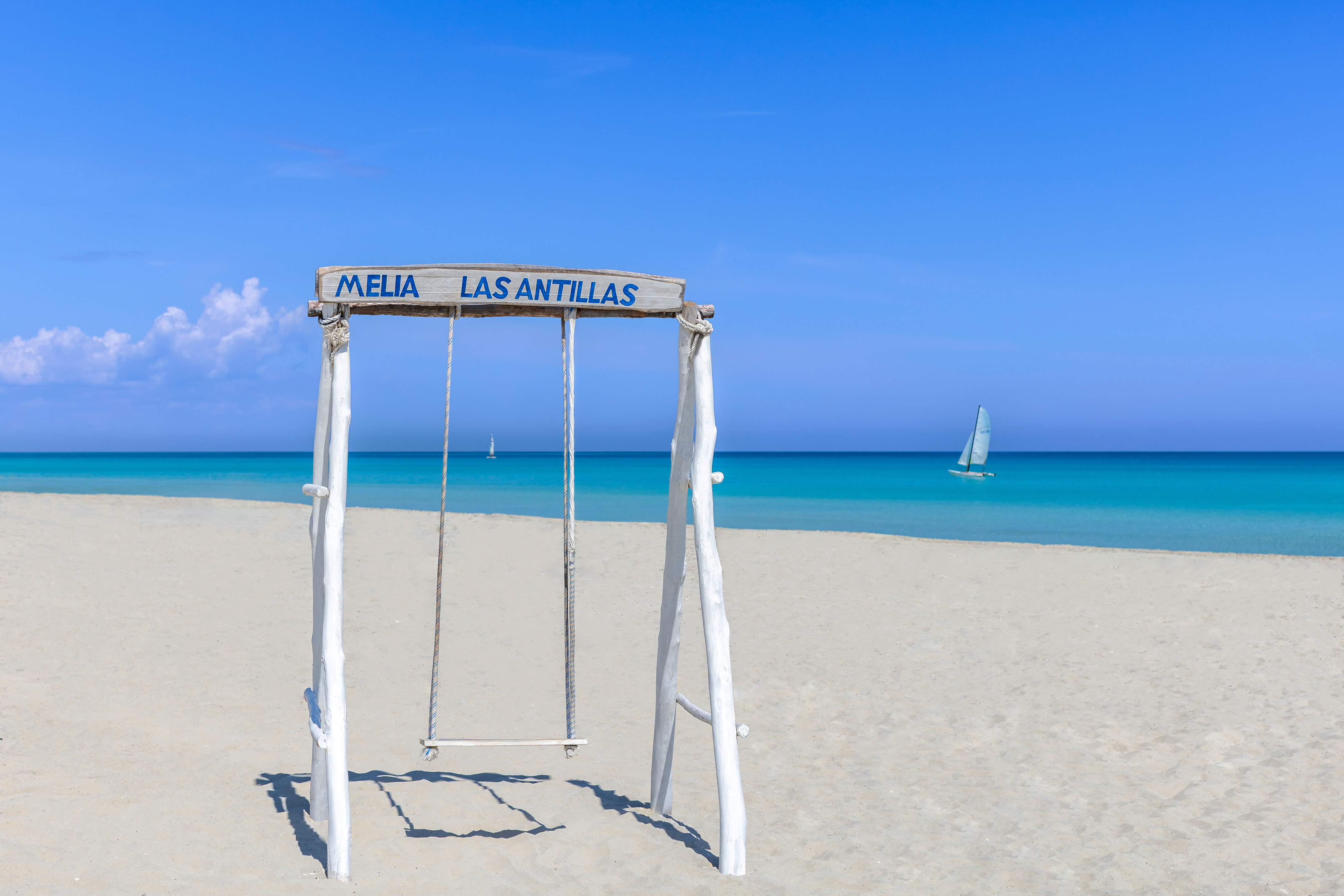 a swing on a beach