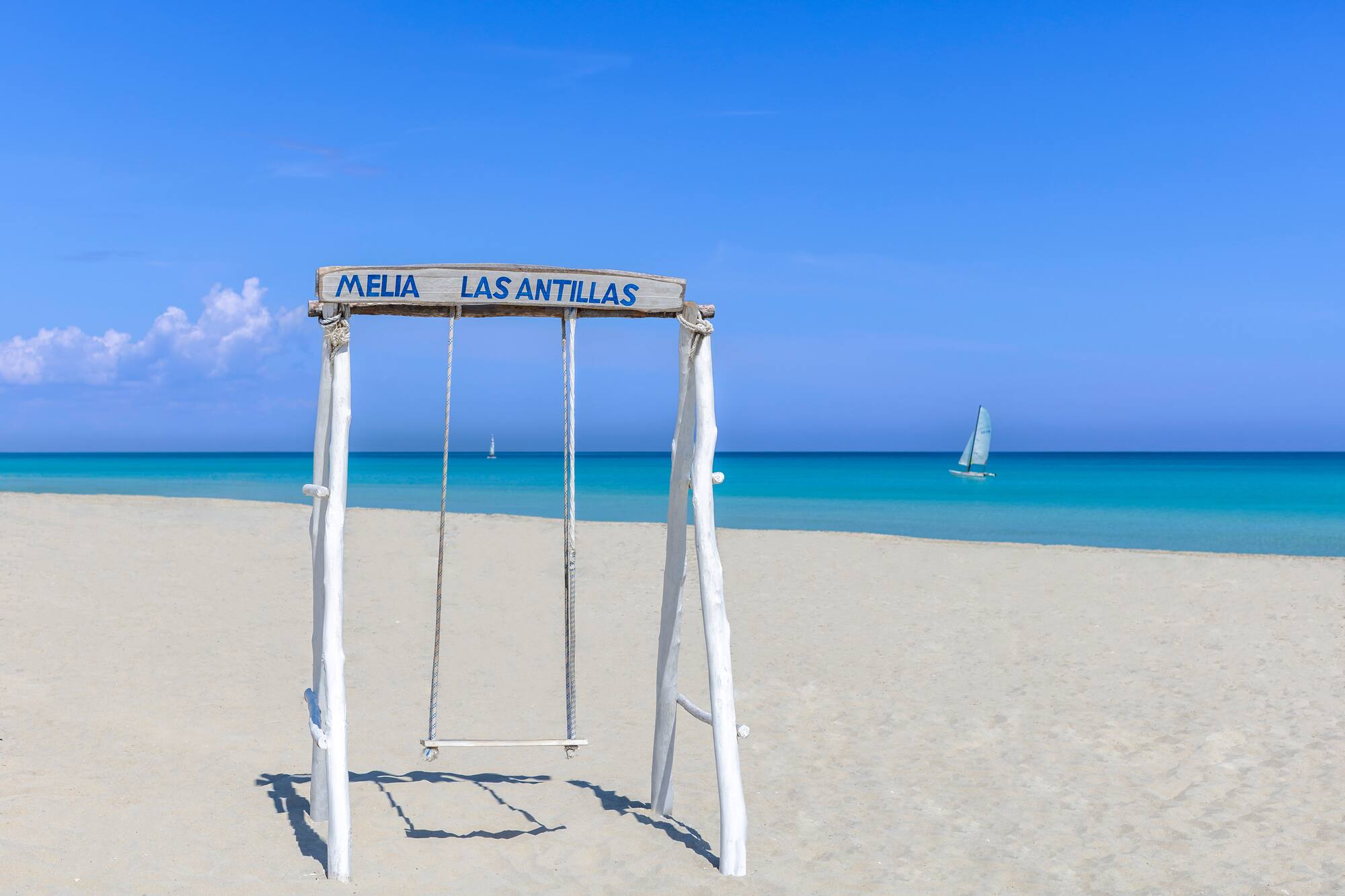 a swing on a beach