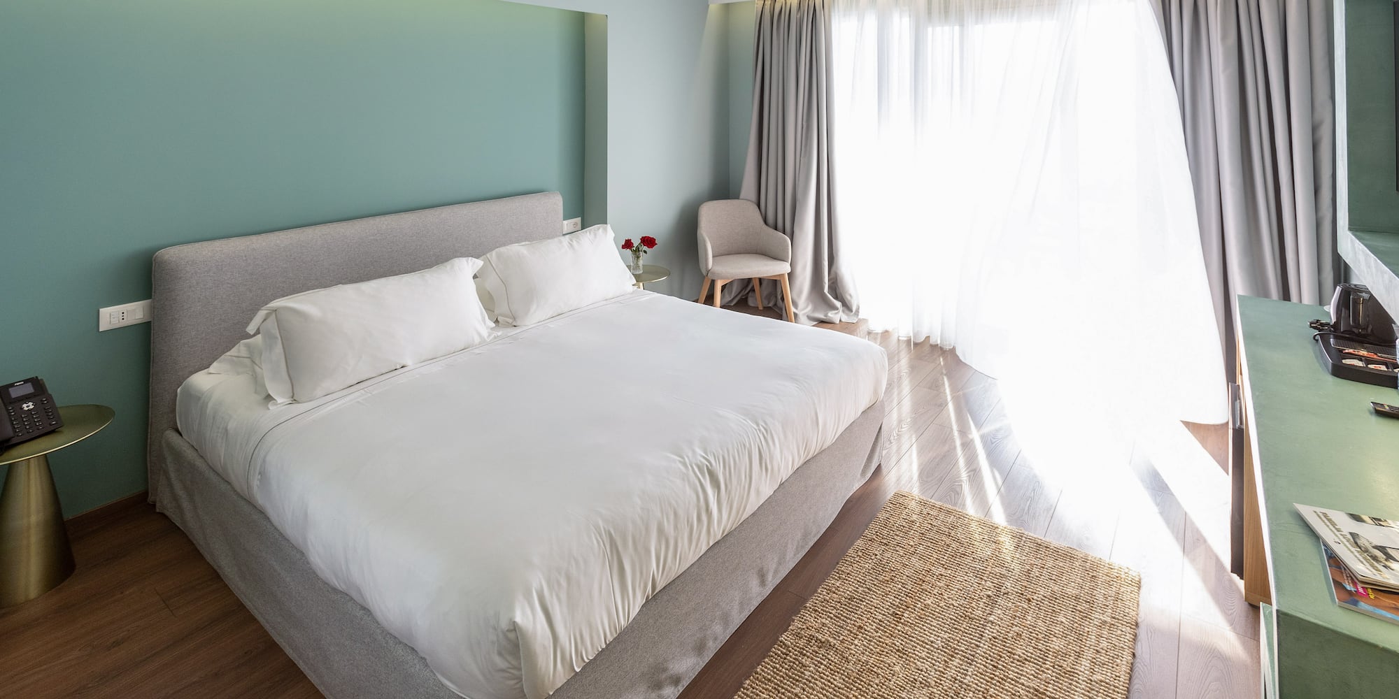 a bedroom with a bed and a chair