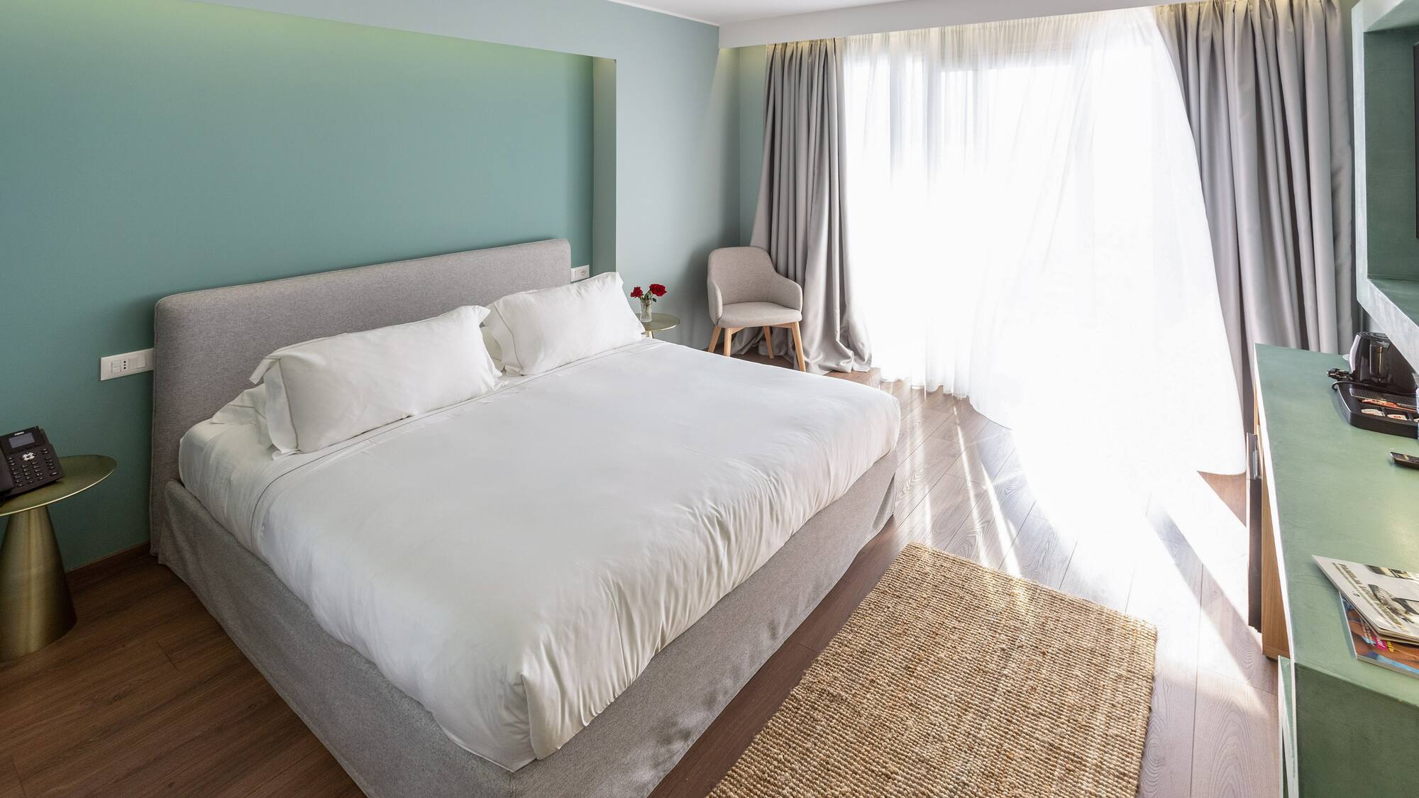 a bedroom with a bed and a chair