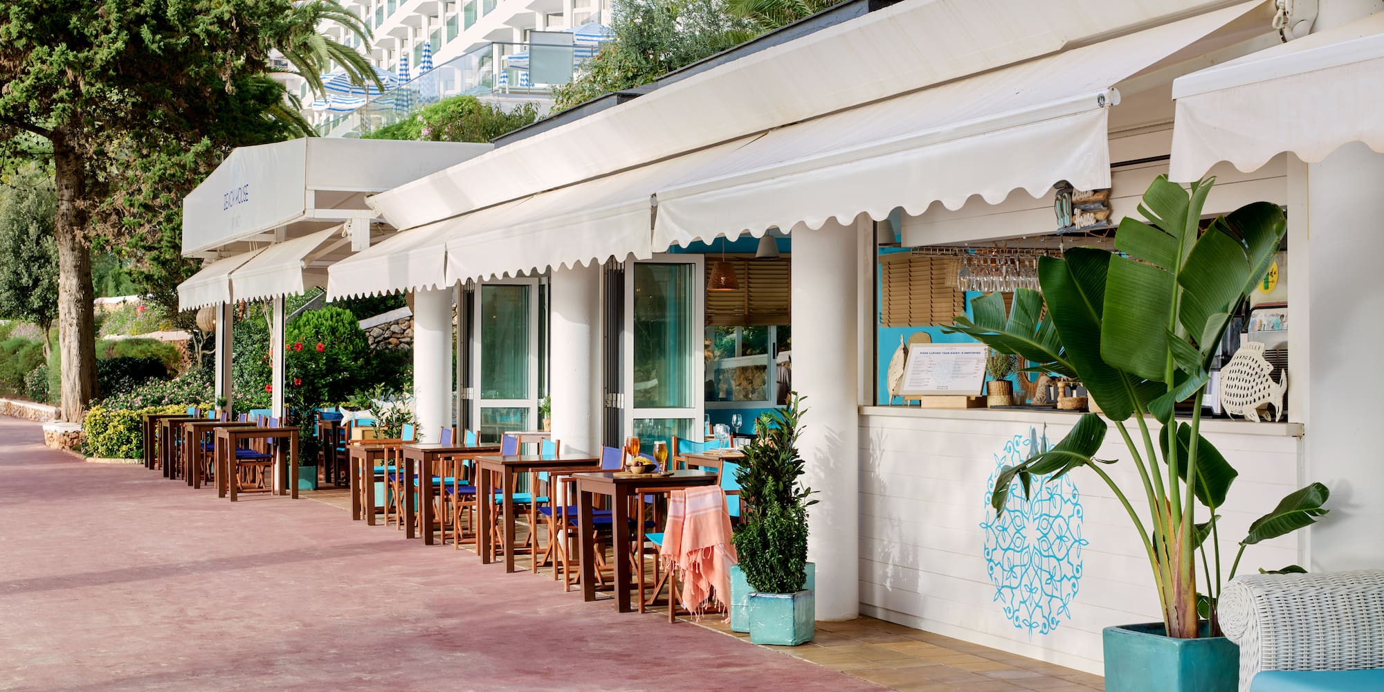 a row of tables outside of a restaurant