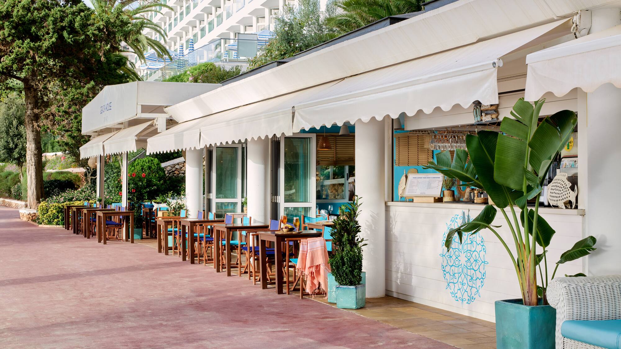 a row of tables outside of a restaurant
