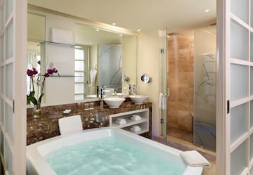 a bathroom with a tub and sink