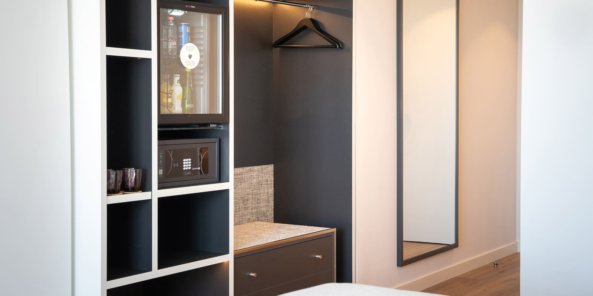 a room with a mirror and a closet