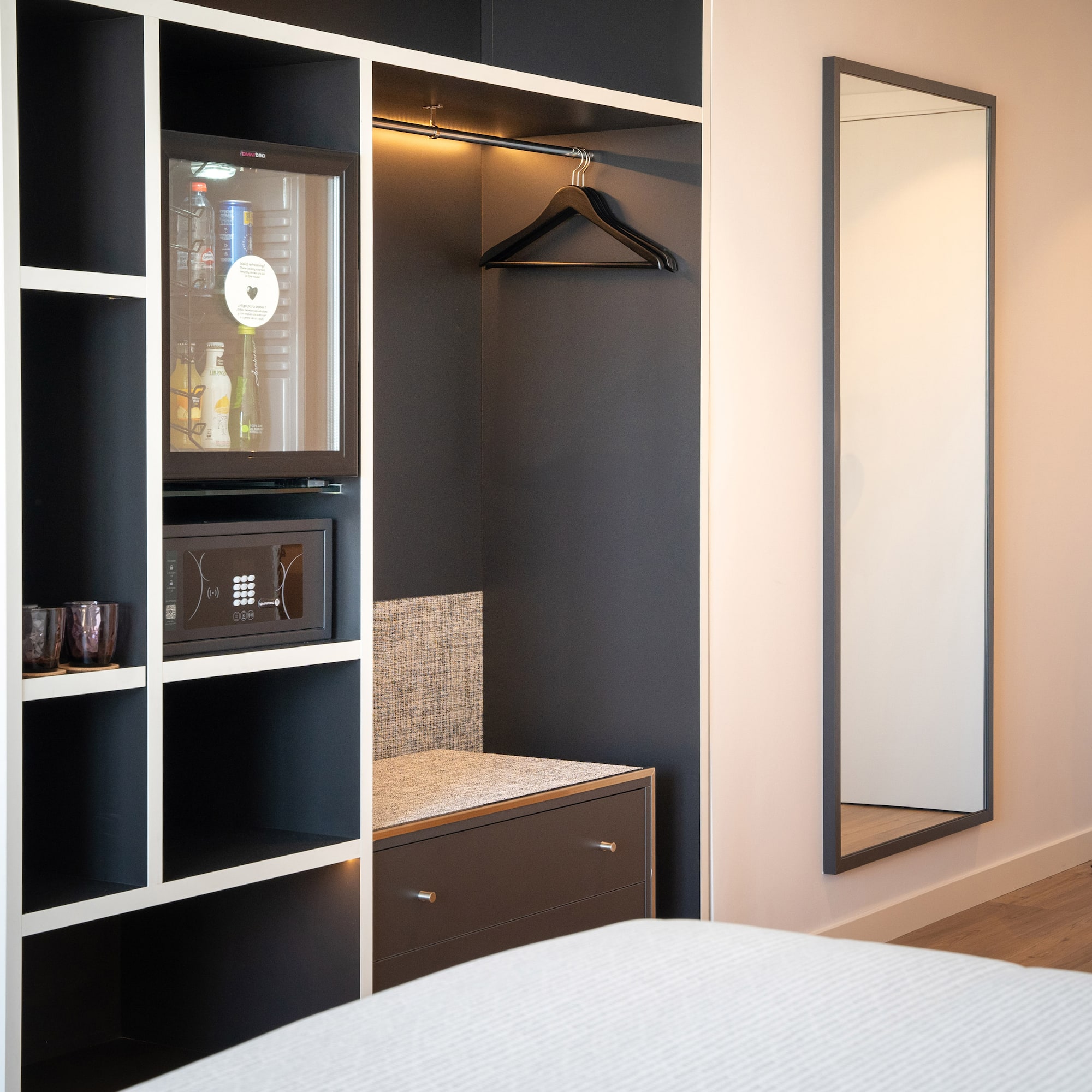 a room with a mirror and a closet