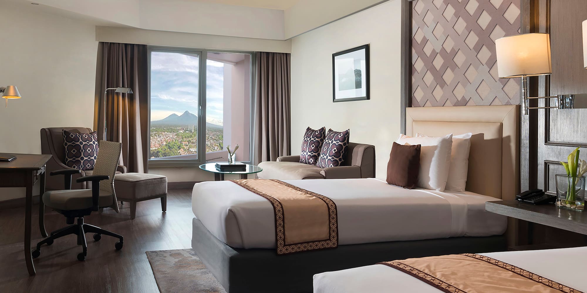 a room with two beds and a window