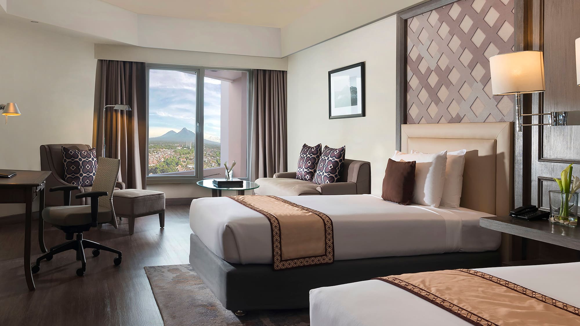 a room with two beds and a window