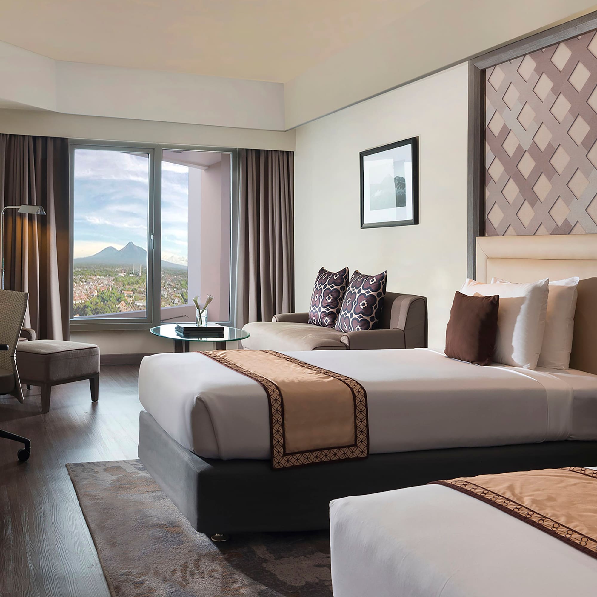 a room with two beds and a window