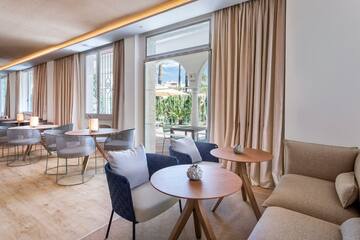 a room with a couch and tables