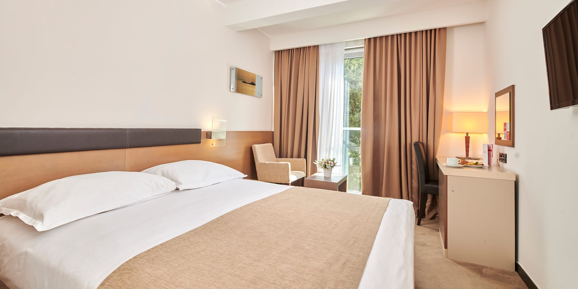 a room with a bed and a desk