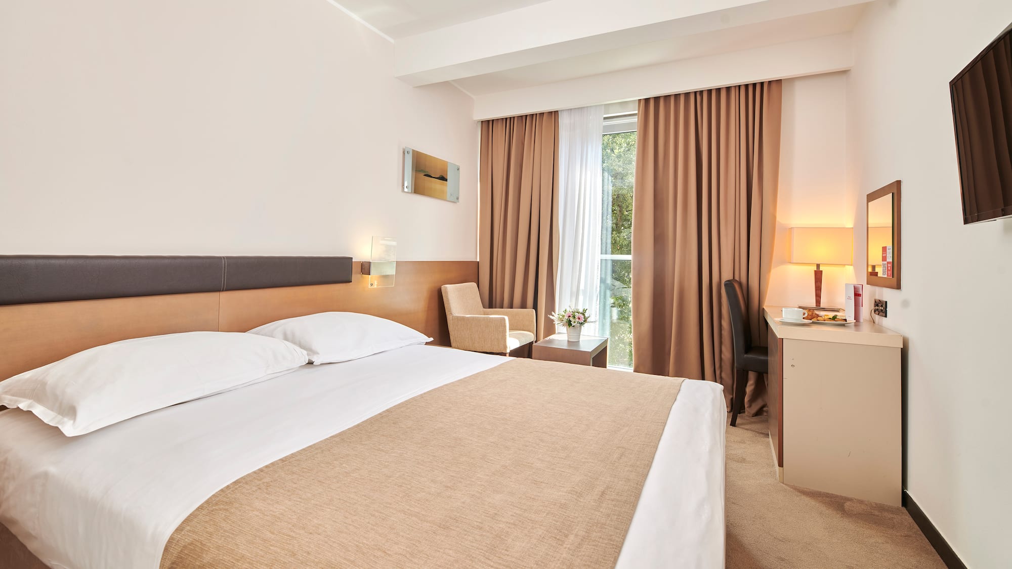 a room with a bed and a desk