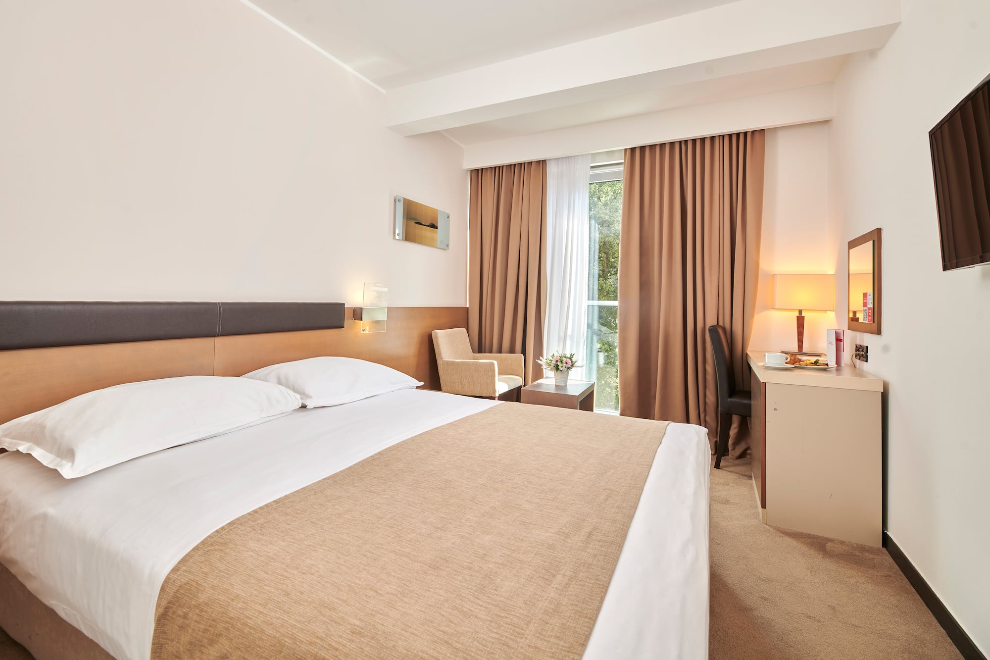 a room with a bed and a desk