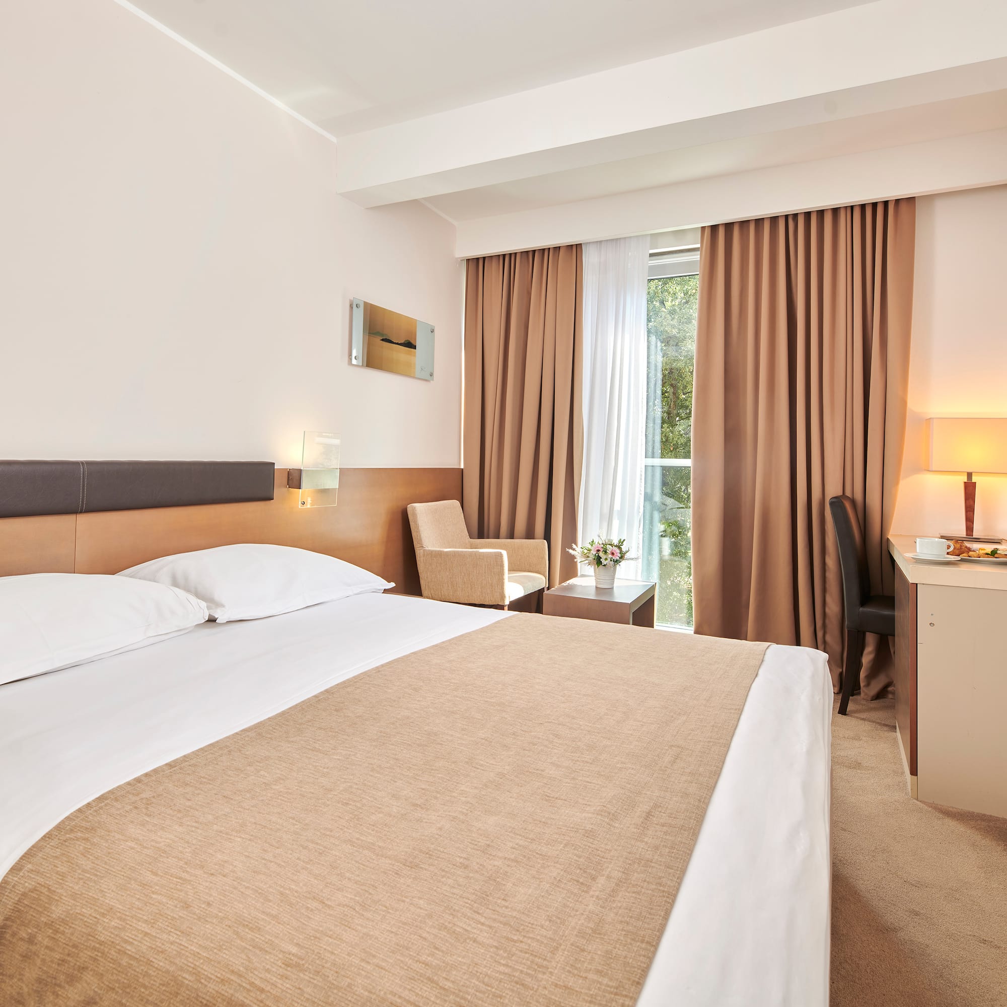 a room with a bed and a desk