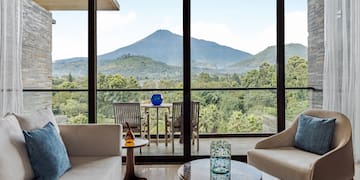 a living room with a view of mountains and trees