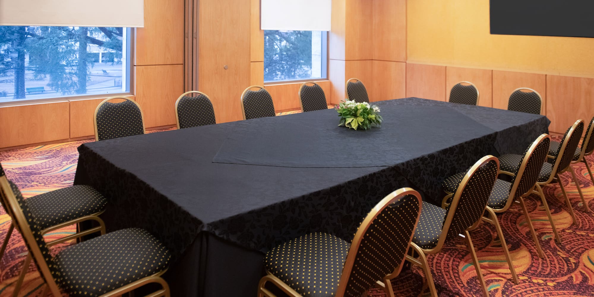 a table with chairs in a room