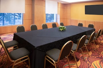 a table with chairs in a room