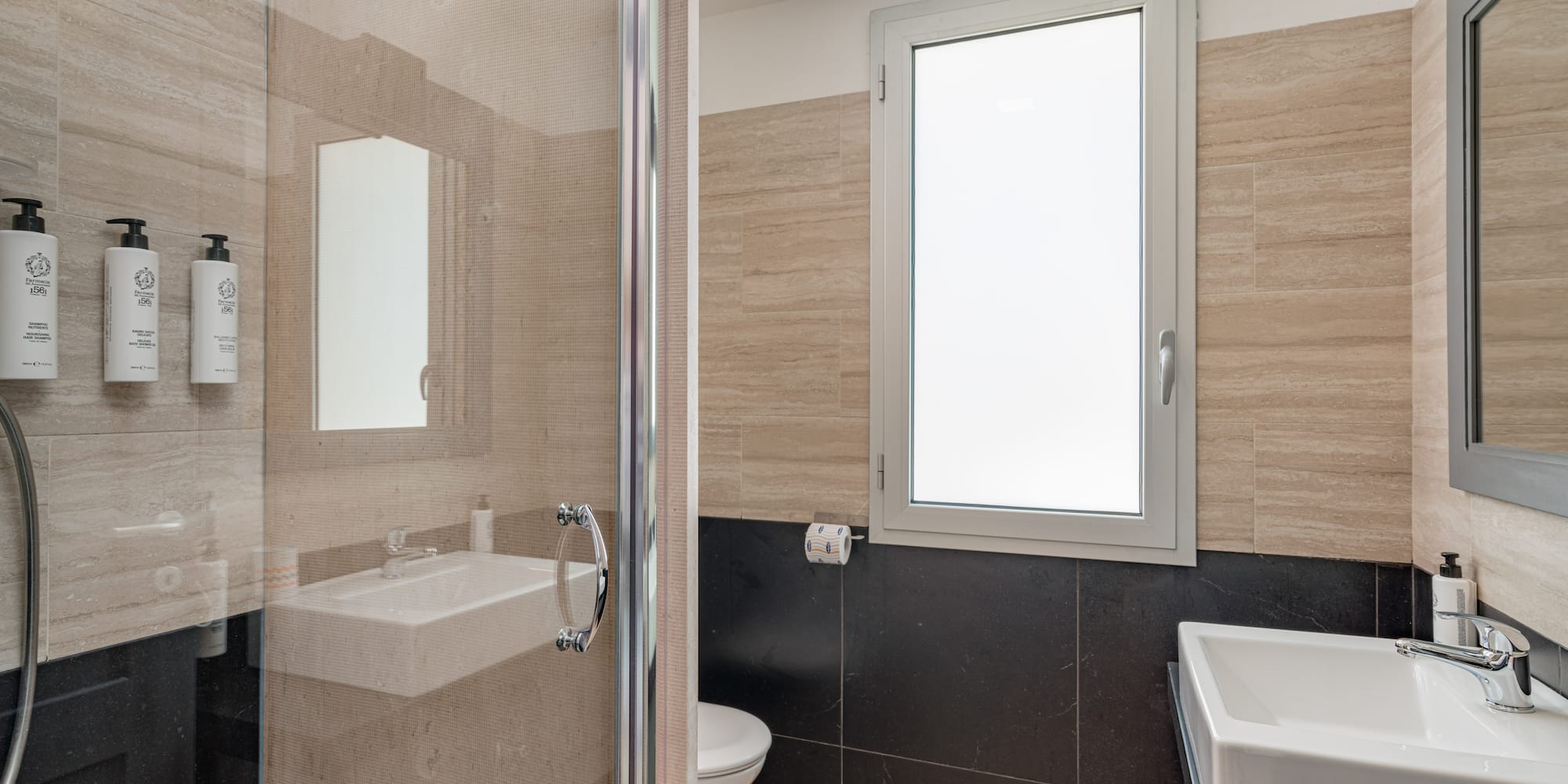 a bathroom with a glass shower door