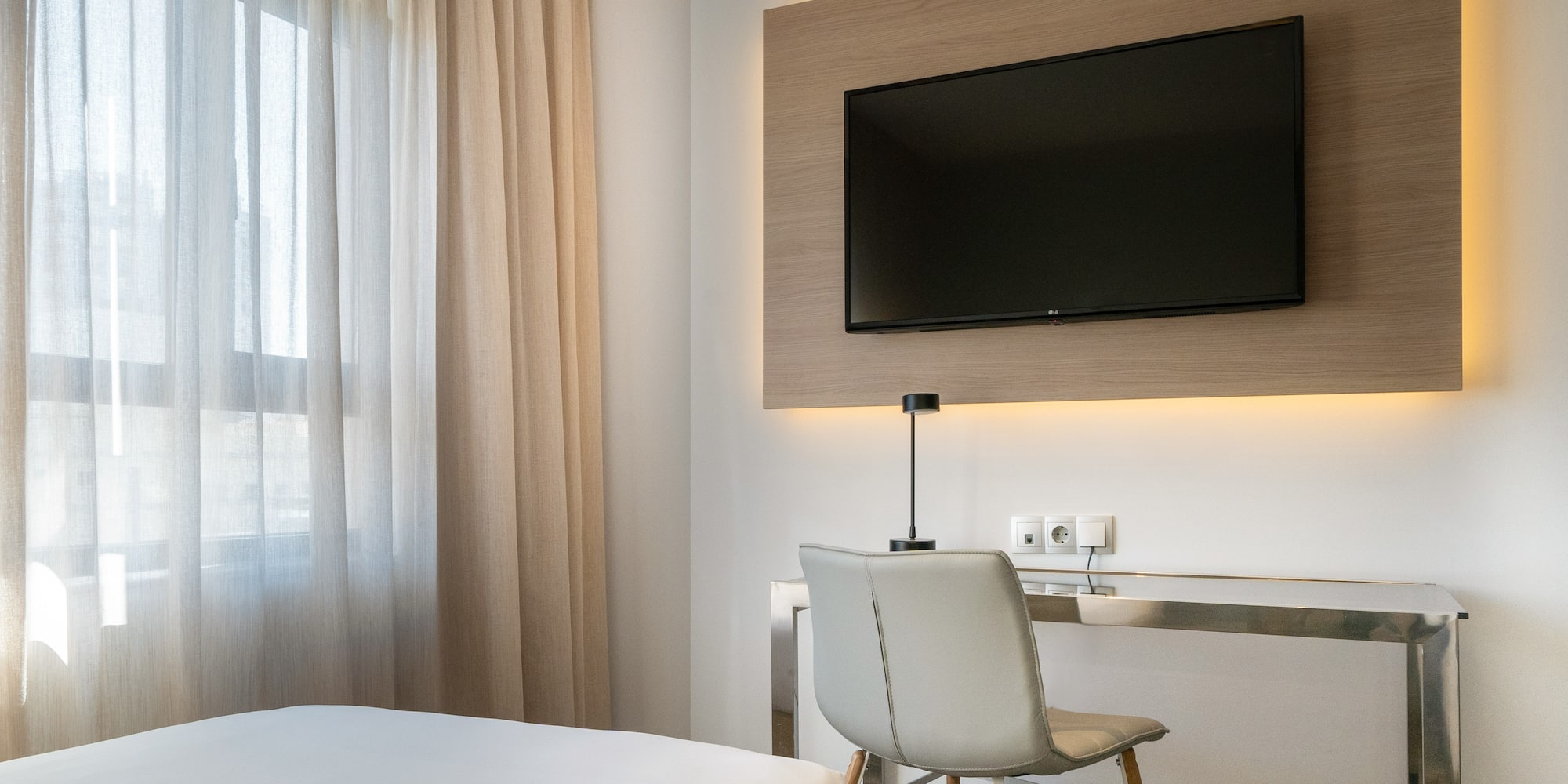 a room with a tv on the wall