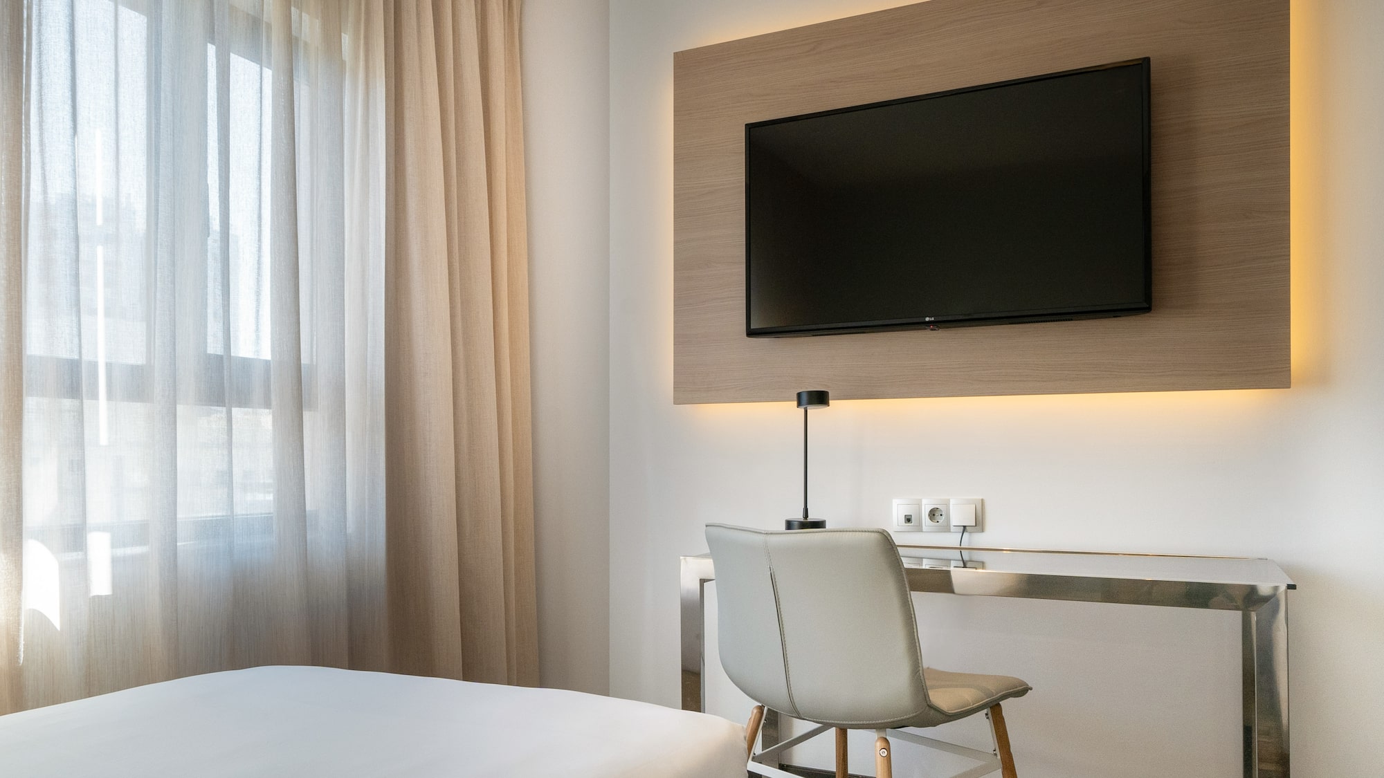 a room with a tv on the wall