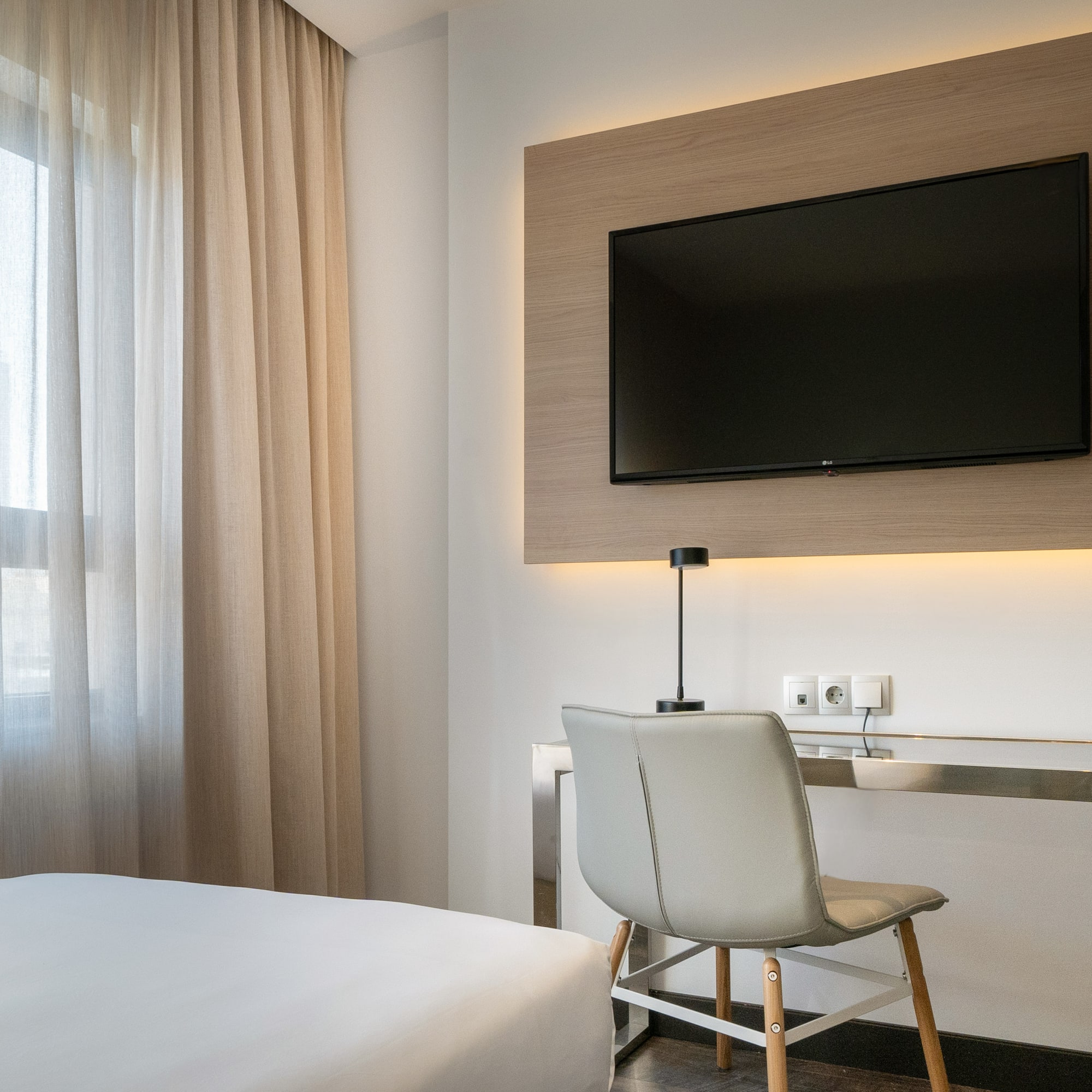 a room with a tv on the wall