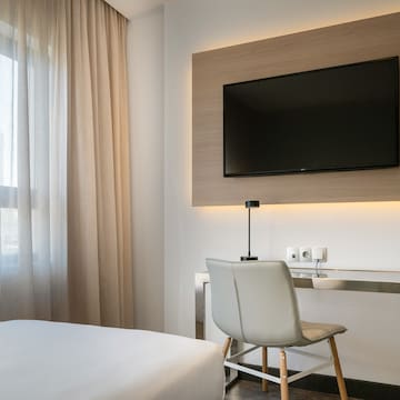 a room with a tv on the wall