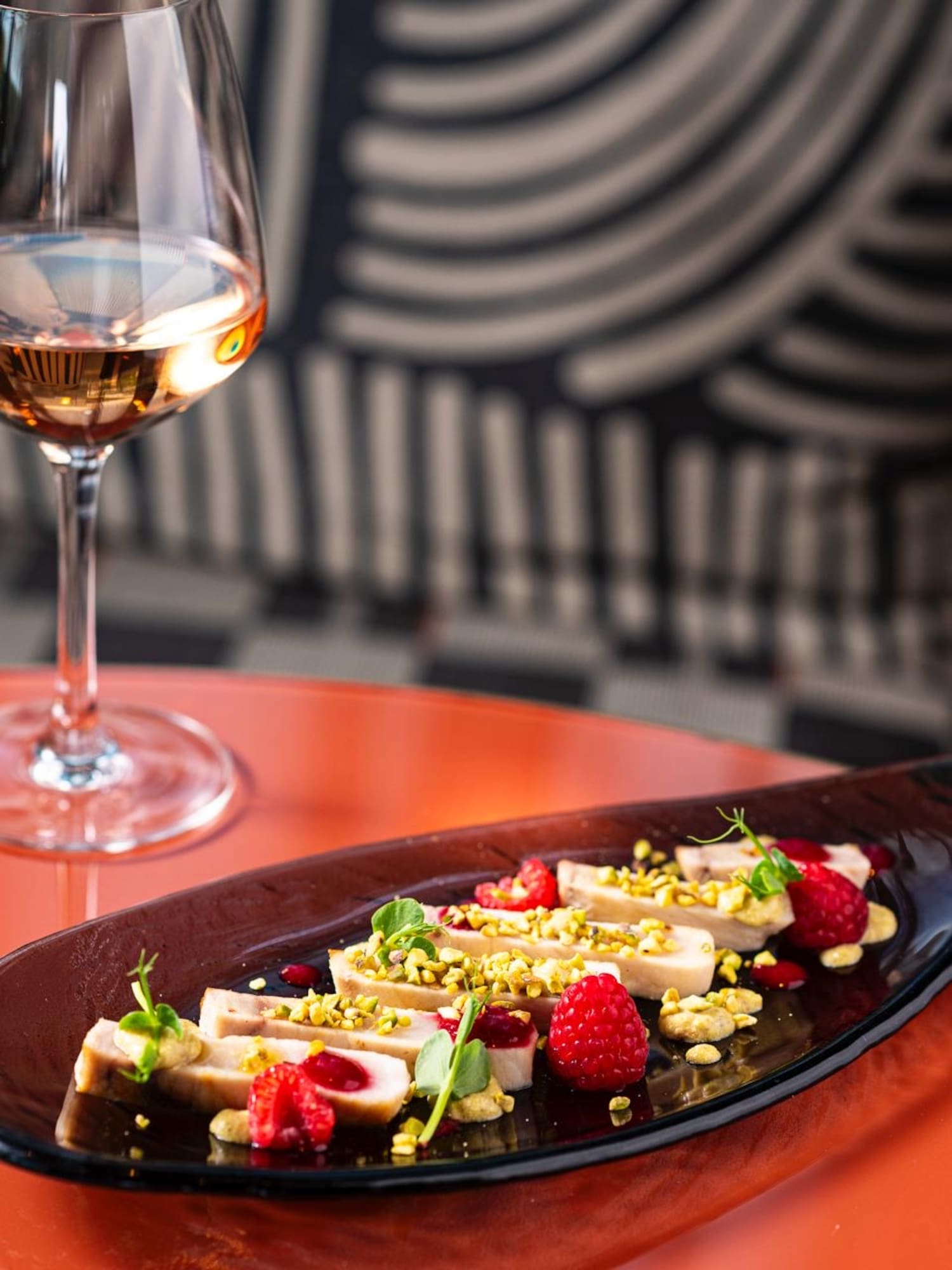 a plate of food and a glass of wine