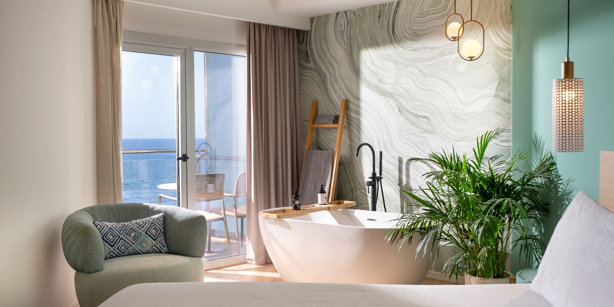 a room with a tub and a bed and a window