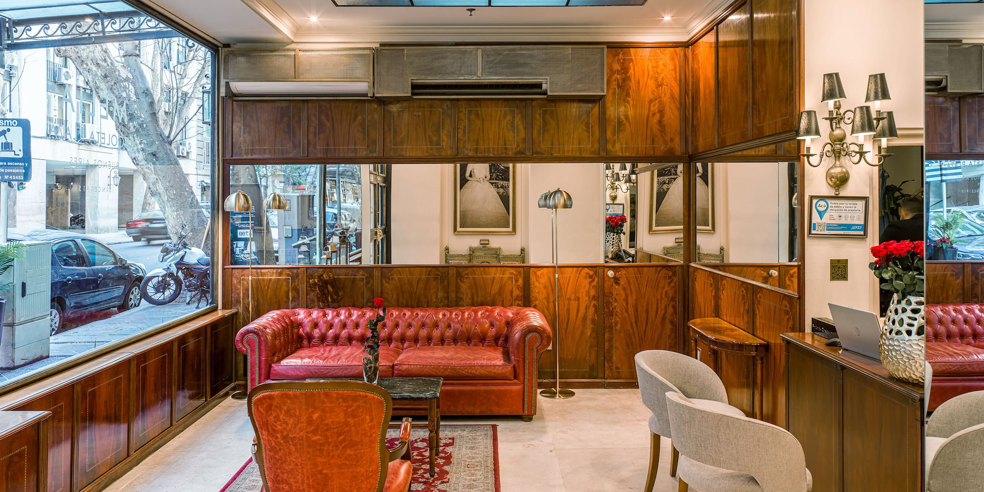 a room with a couch and chairs