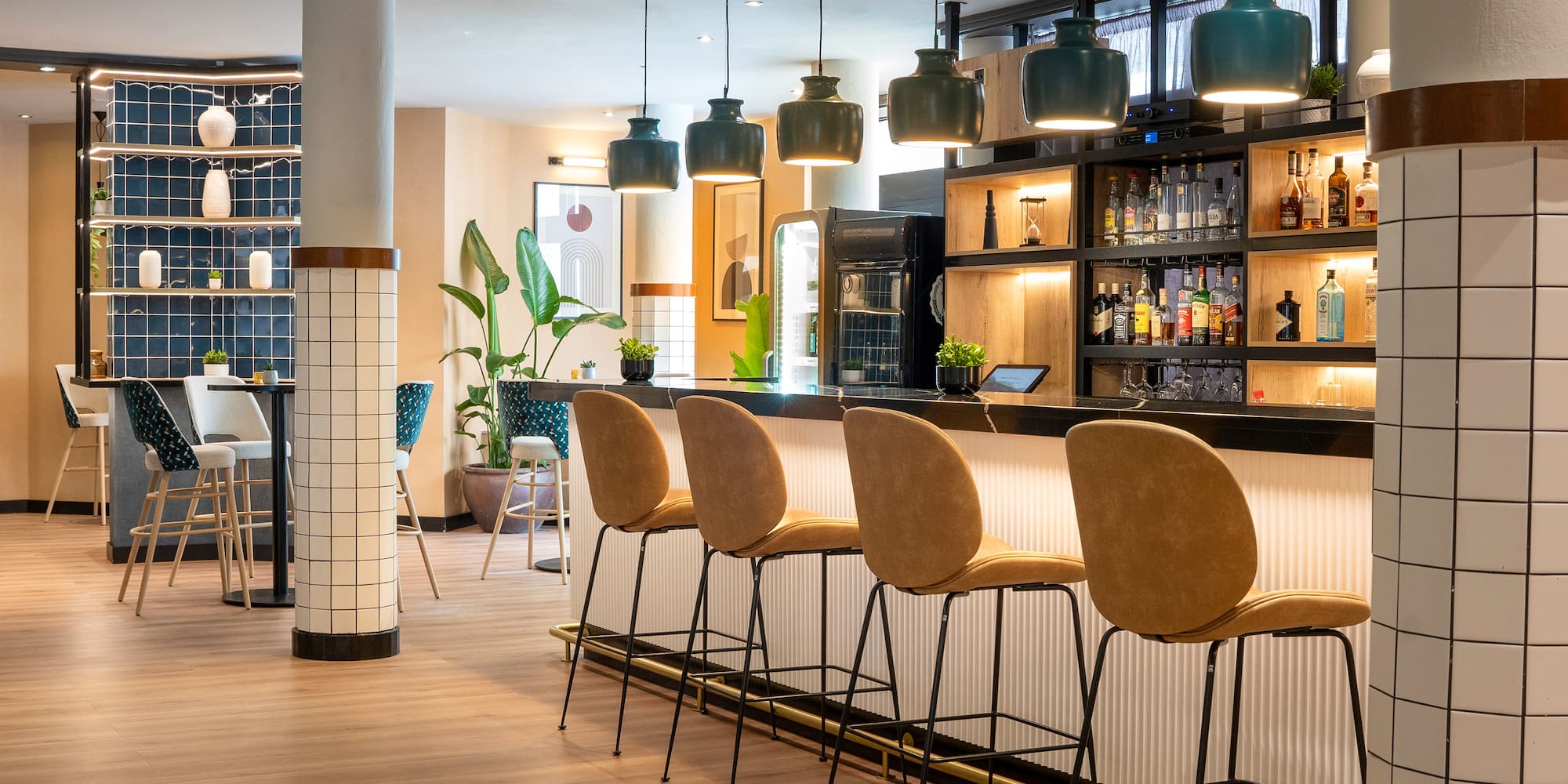 a bar with chairs and a shelf