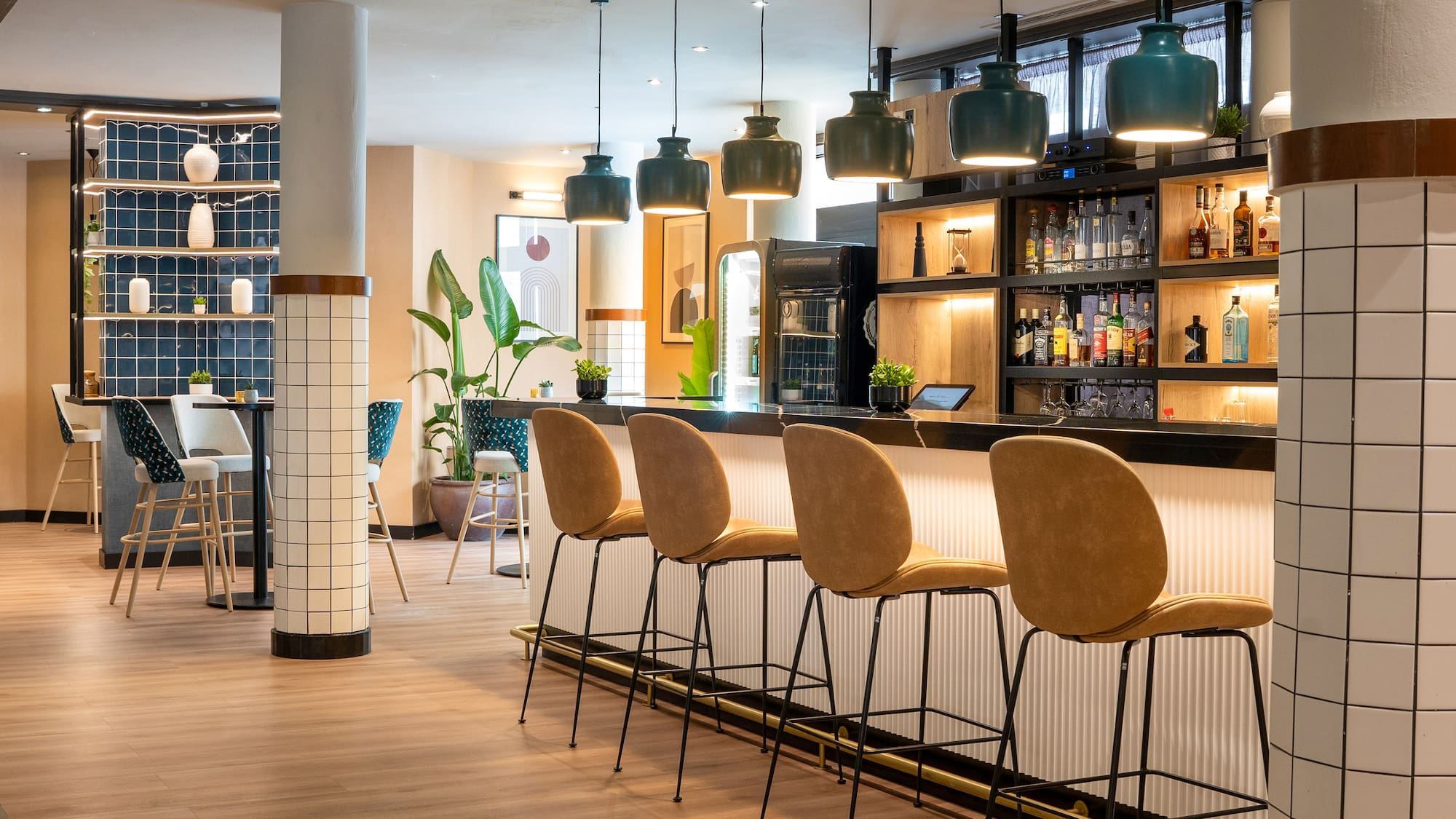 a bar with chairs and a shelf