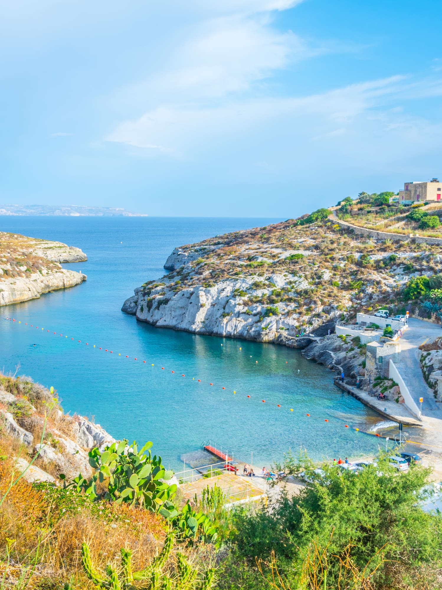 a body of water with rocks and a body of water