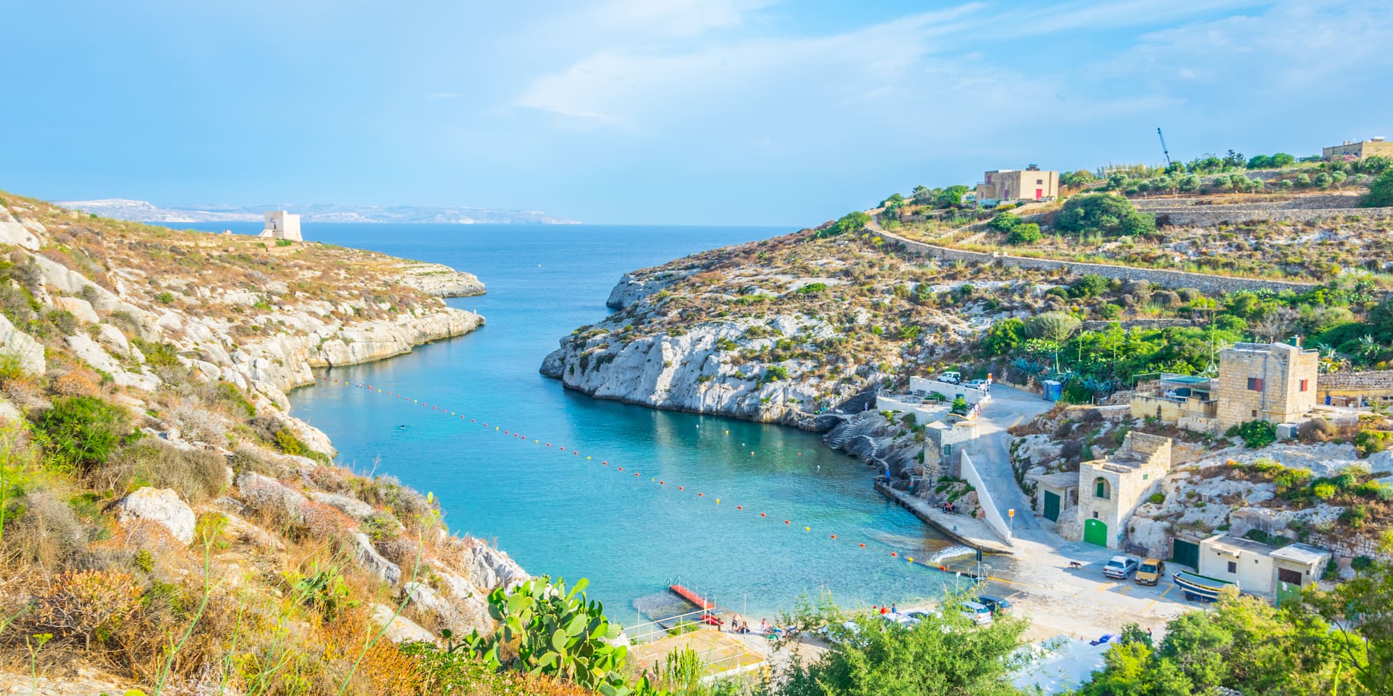 a body of water with rocks and a body of water
