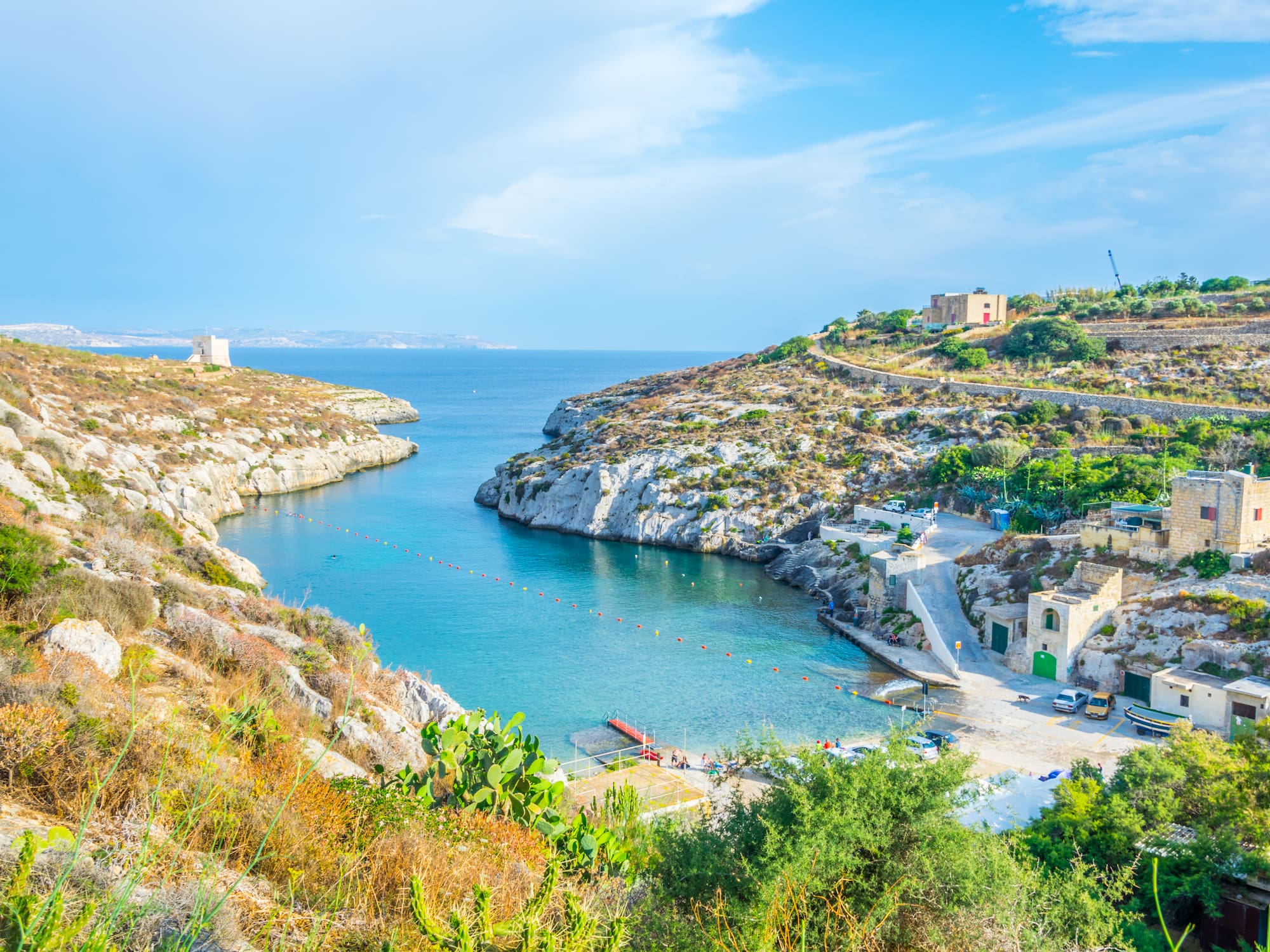 a body of water with rocks and a body of water