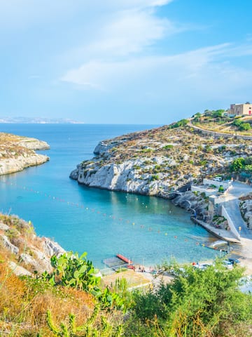 a body of water with rocks and a body of water