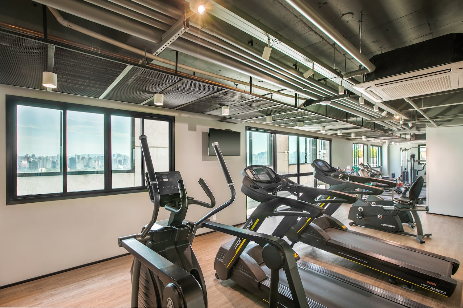 a room with treadmills and a window