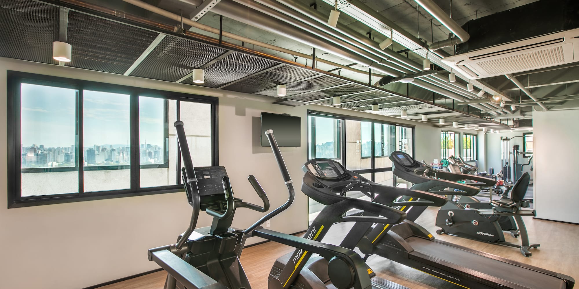 a room with treadmills and a window