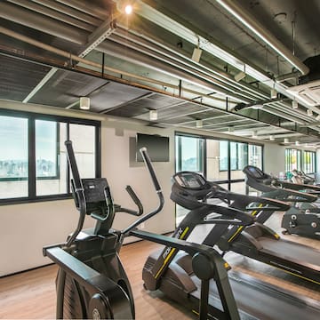 a room with treadmills and a window