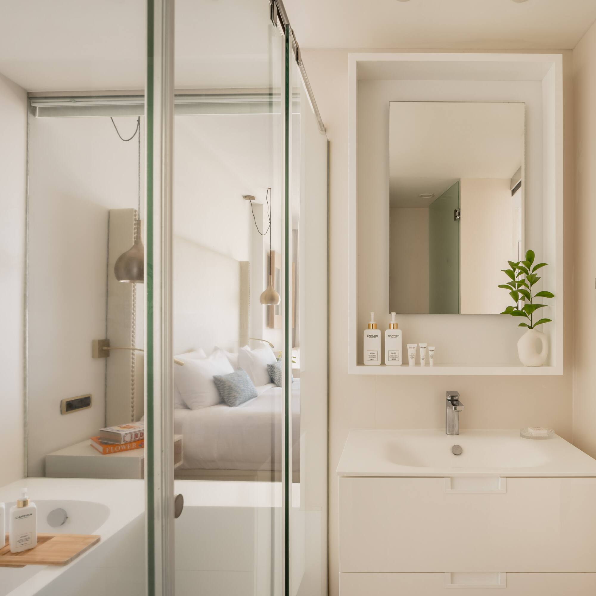 a bathroom with a glass shower door