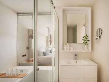a bathroom with a glass shower door
