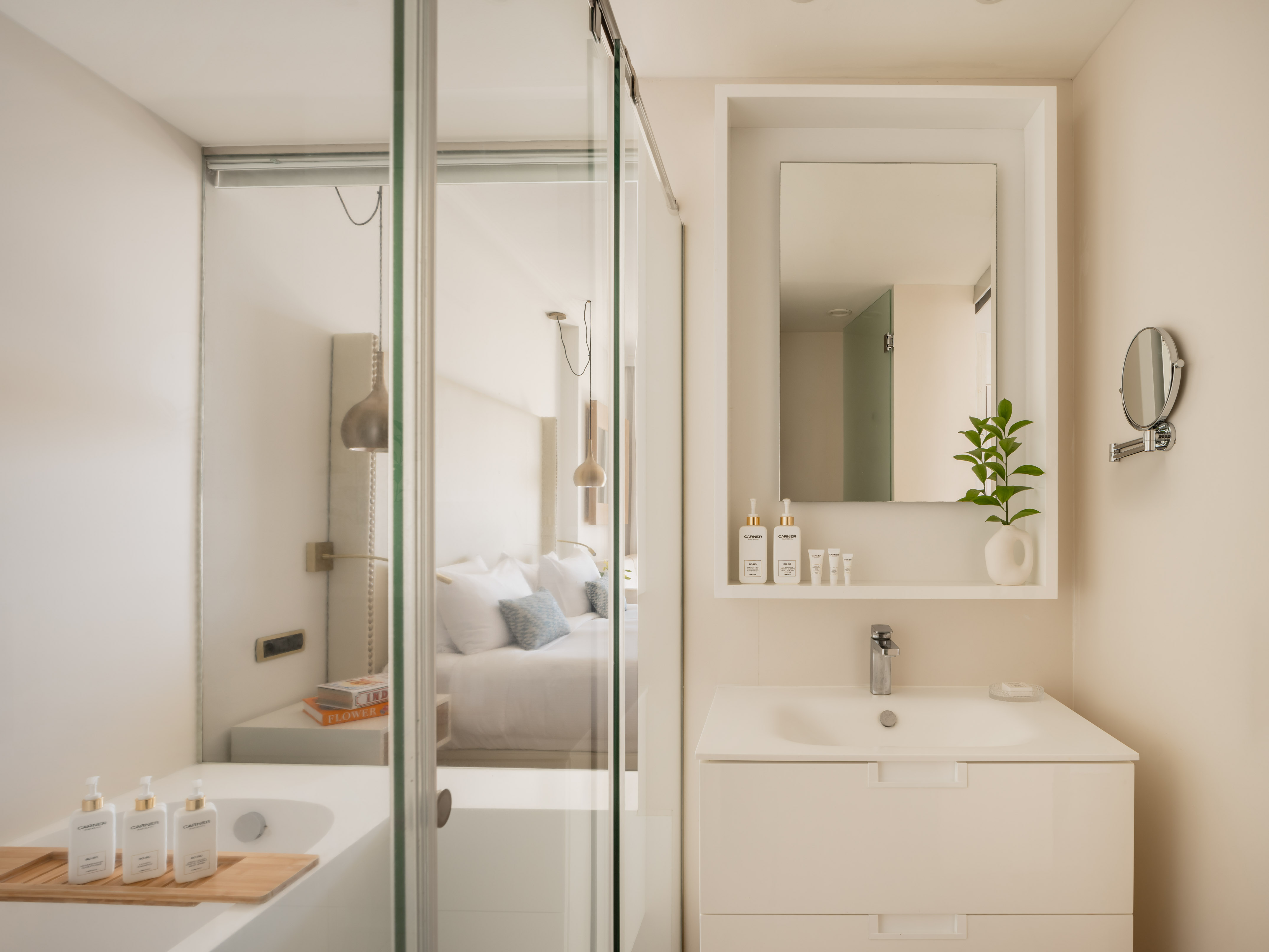 a bathroom with a glass shower door
