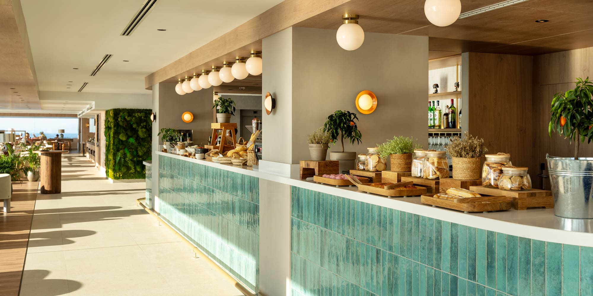 a restaurant with a counter and shelves