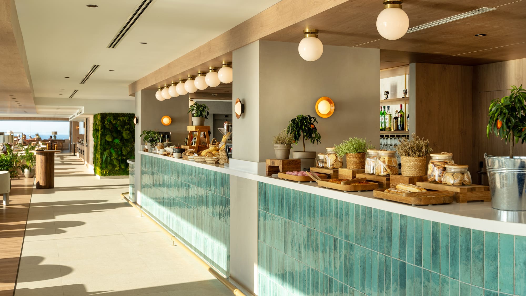 a restaurant with a counter and shelves