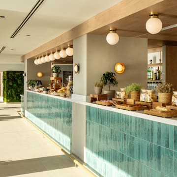 a restaurant with a counter and shelves