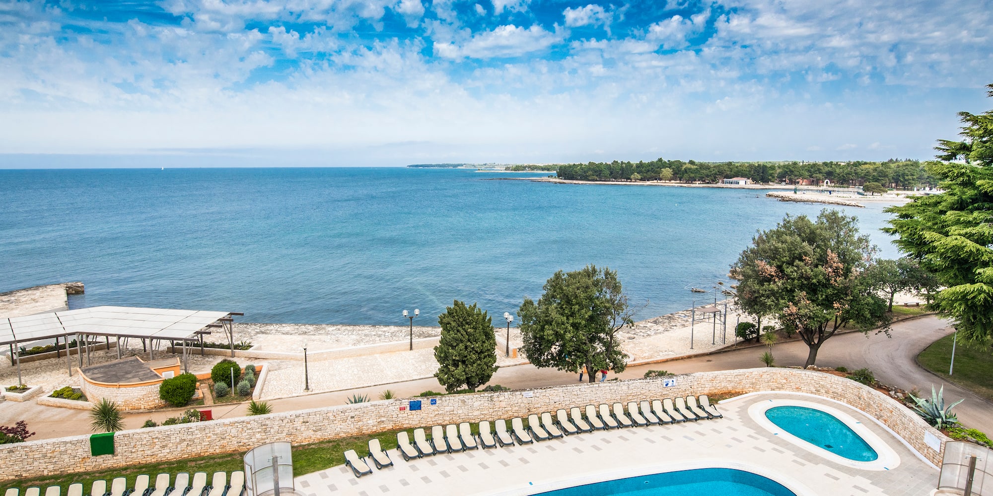 a pool next to a body of water